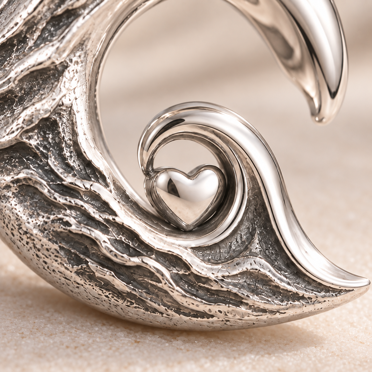 Close-up detail of the polished heart inside the ocean wave charm