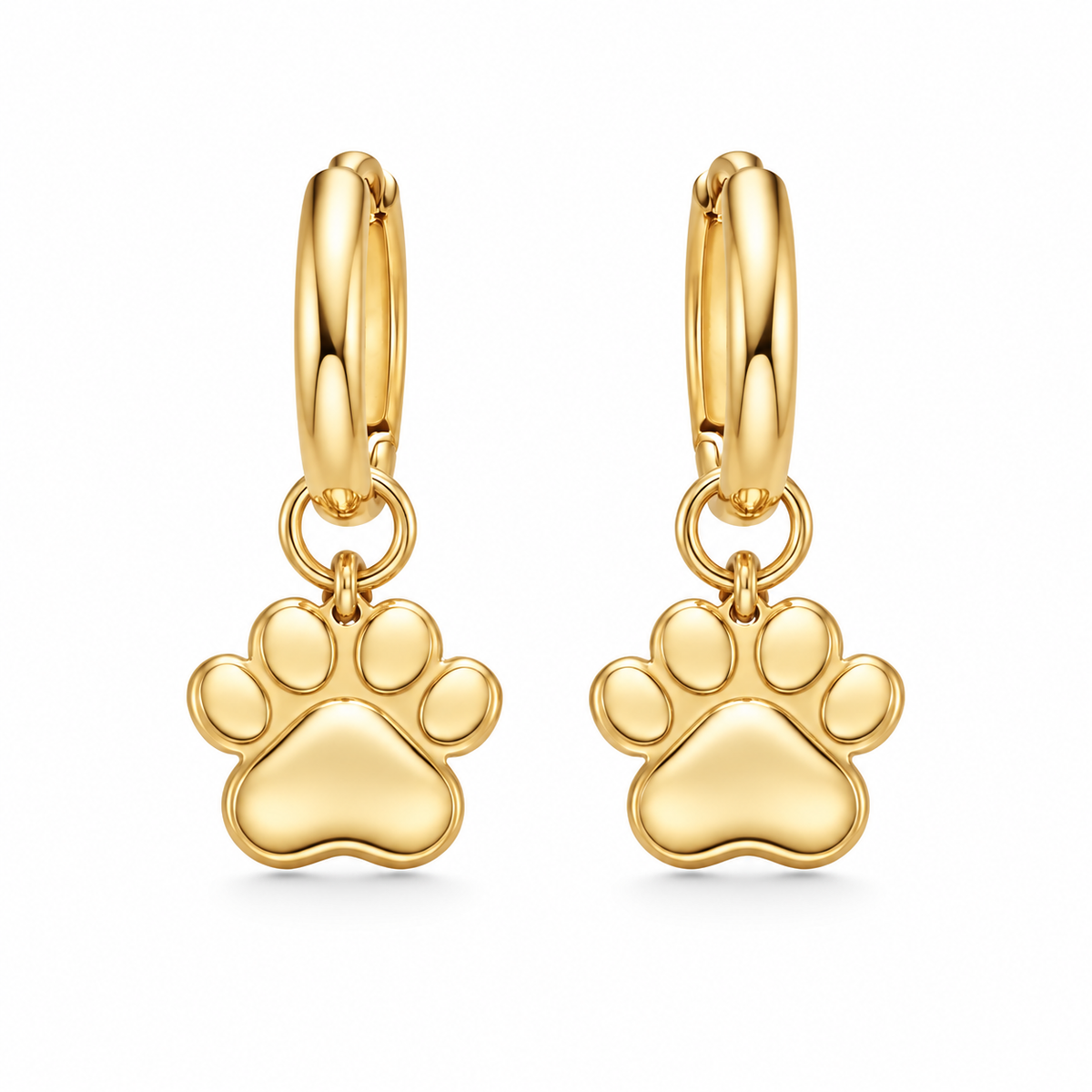 Front view of gold Little Paw Huggie Earrings showing the detailed paw print charm and hoop.