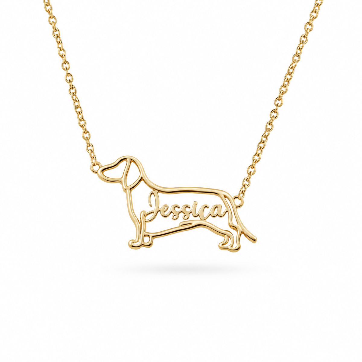 Gold vermeil custom dog outline handcrafted necklace featuring a dachshund shape with the name Jessica engraved.