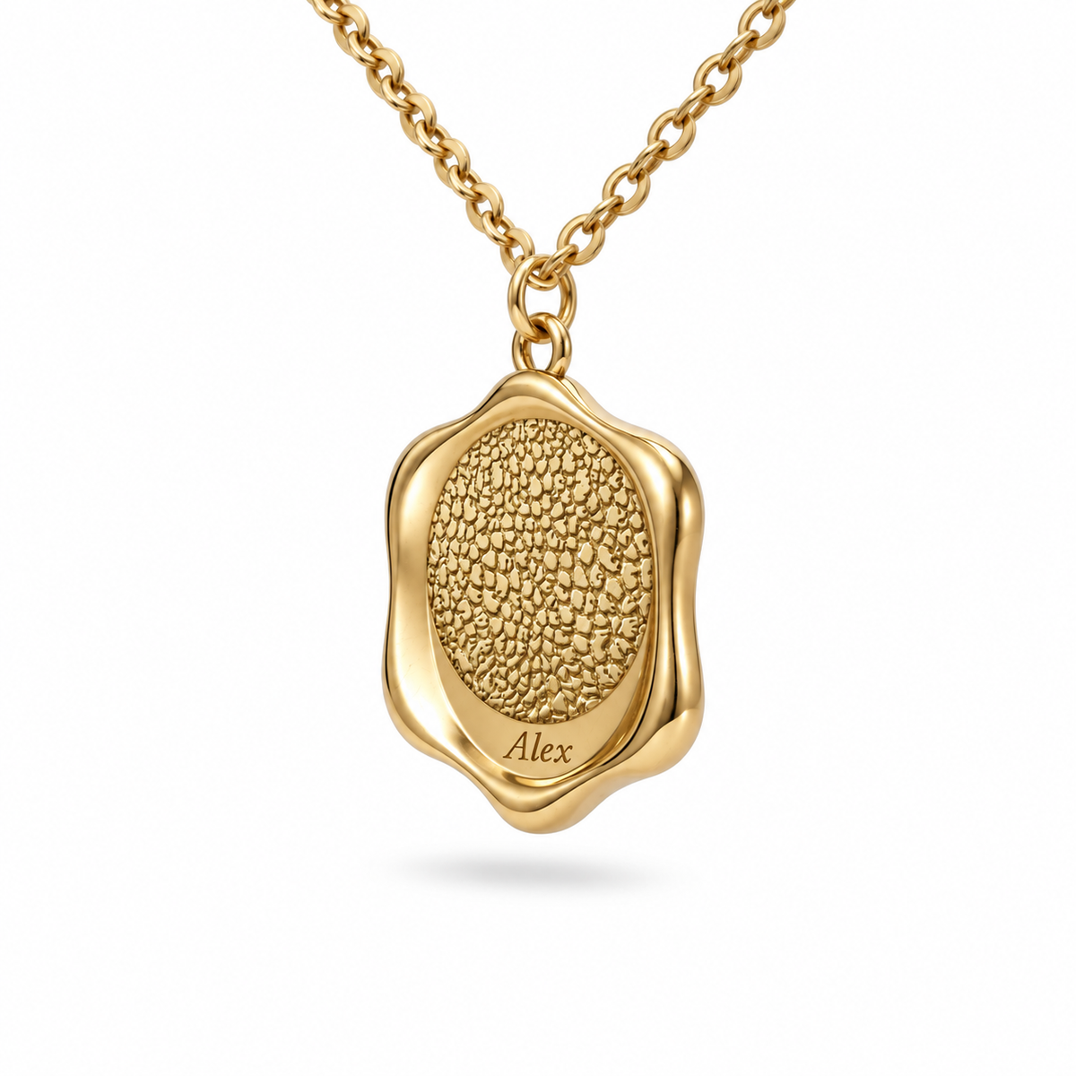 Side view of a gold personalized pet nose necklace showing the texture and thickness of the pendant.
