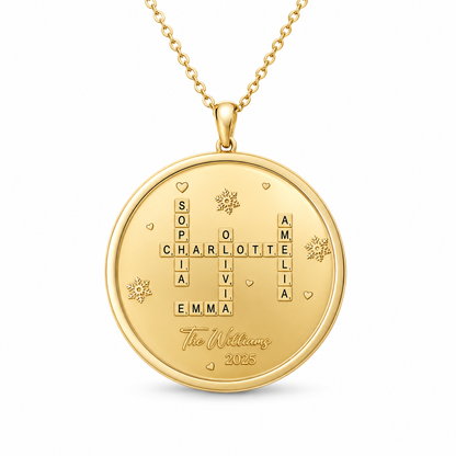 Round gold pendant featuring a personalized family name crossword design with small heart and snowflake accents