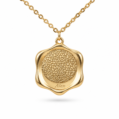 Gold scalloped edge pendant featuring a detailed pet nose engraving and personalized name at the bottom.