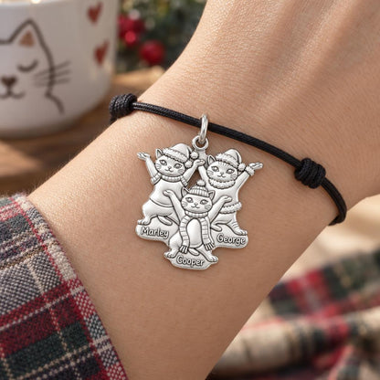 Festive Feline Trio Charm Bracelet – Personalized Cat Mom Gift – worn on the wrist on a black cord bracelet