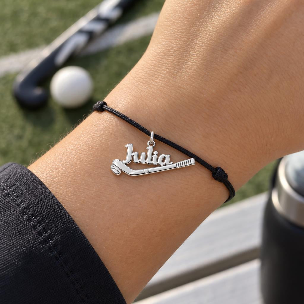 Field Hockey Stick Charm Bracelet – Personalized Athlete Gift – worn on the wrist on a black cord bracelet