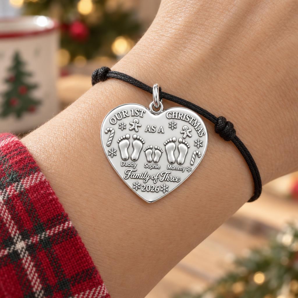 First Christmas Tiny Footprints Charm Bracelet – Personalized Mom Gift – worn on the wrist on a black cord bracelet