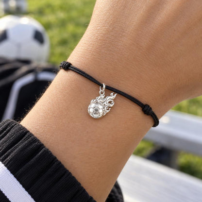 Flaming Soccer Ball Charm Bracelet – Personalized Athlete Gift – worn on the wrist on a black cord bracelet