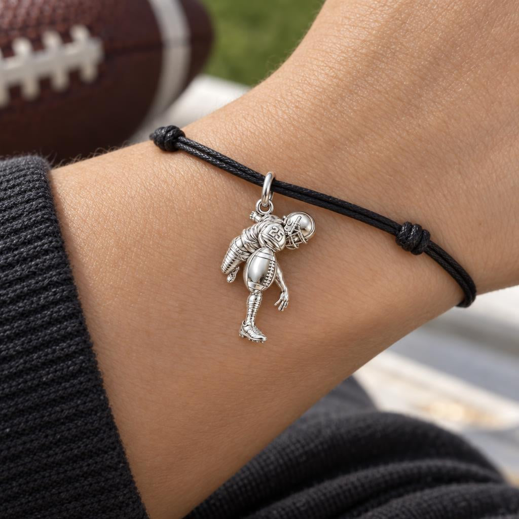 Football Star In Motion Charm Bracelet – Personalized Mom Gift – worn on the wrist on a black cord bracelet