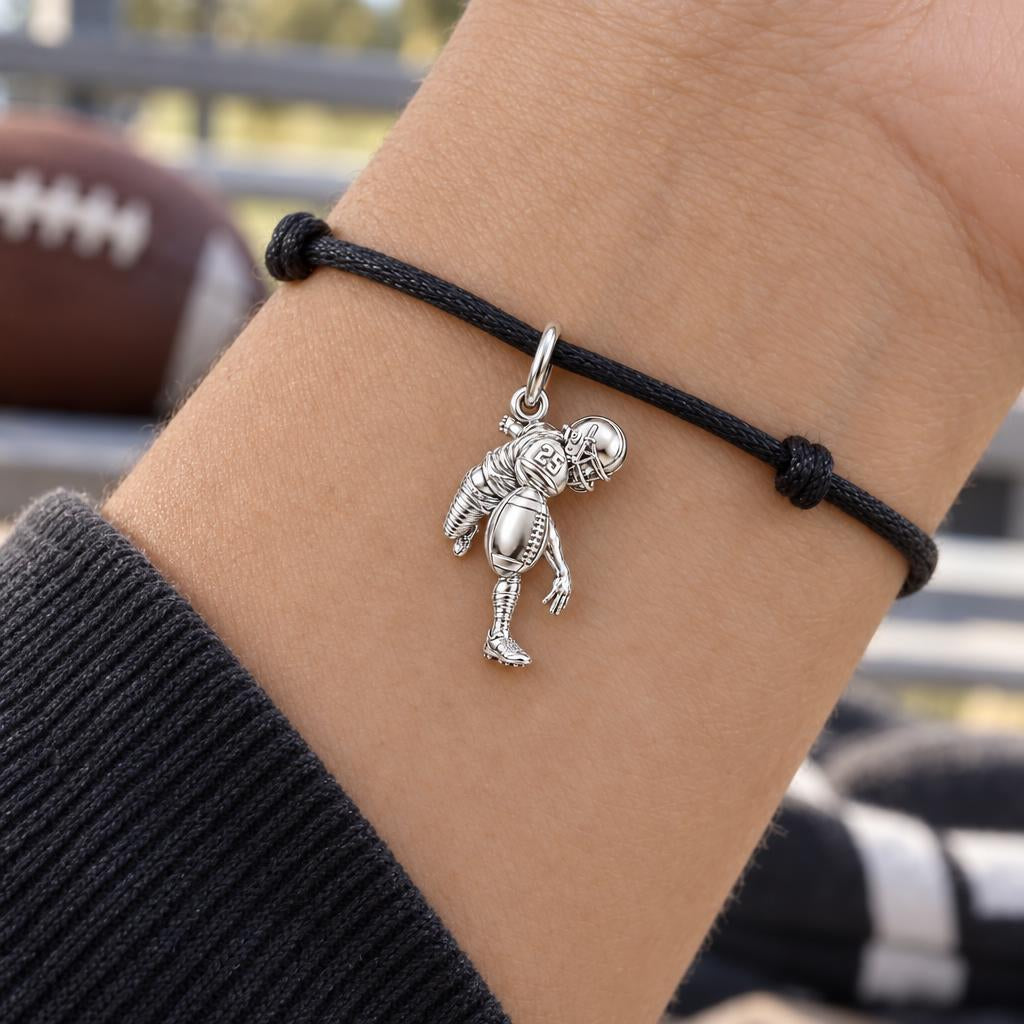 Football Star In Motion Charm Bracelet – Personalized Mom Gift – worn on the wrist on a black cord bracelet