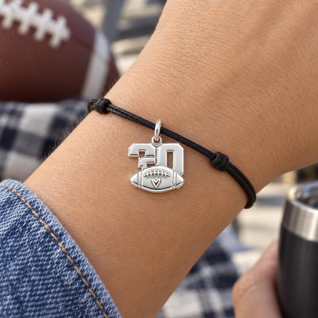 Game Day Heart Charm Bracelet – Personalized Football Mom Gift – worn on the wrist on a black cord bracelet