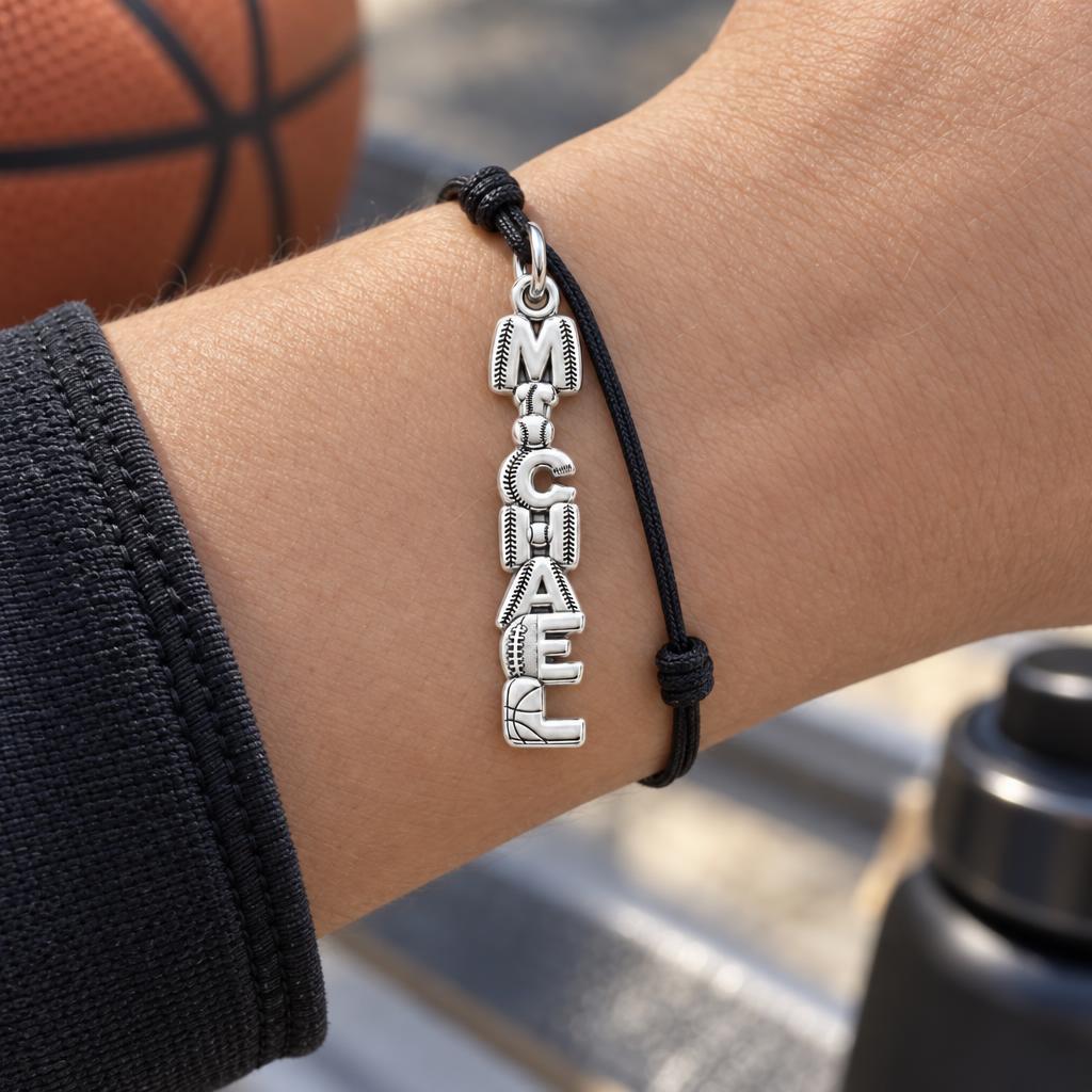 Game Day Spirit Charm Bracelet – Personalized Athlete Gift – worn on the wrist on a black cord bracelet
