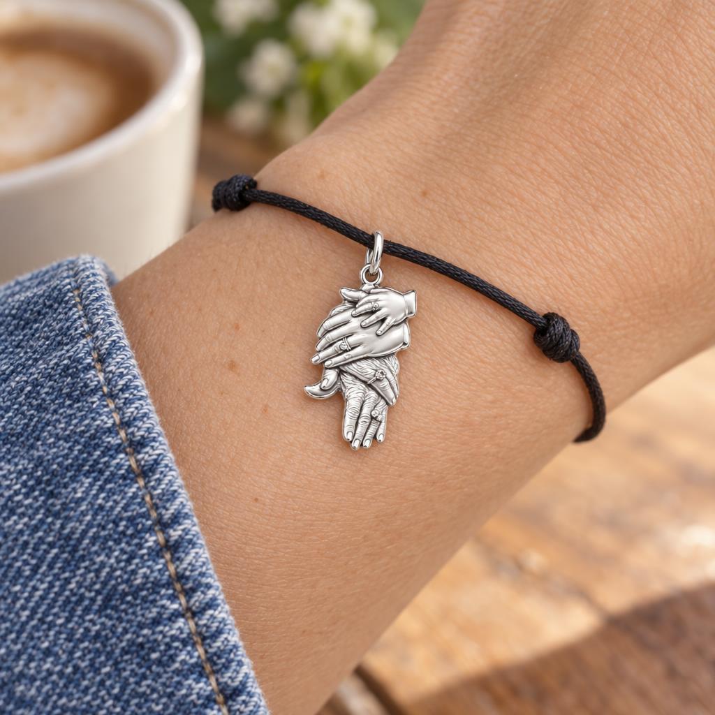 Generations Held Together Charm Bracelet – Personalized Mom Gift – worn on the wrist on a black cord bracelet