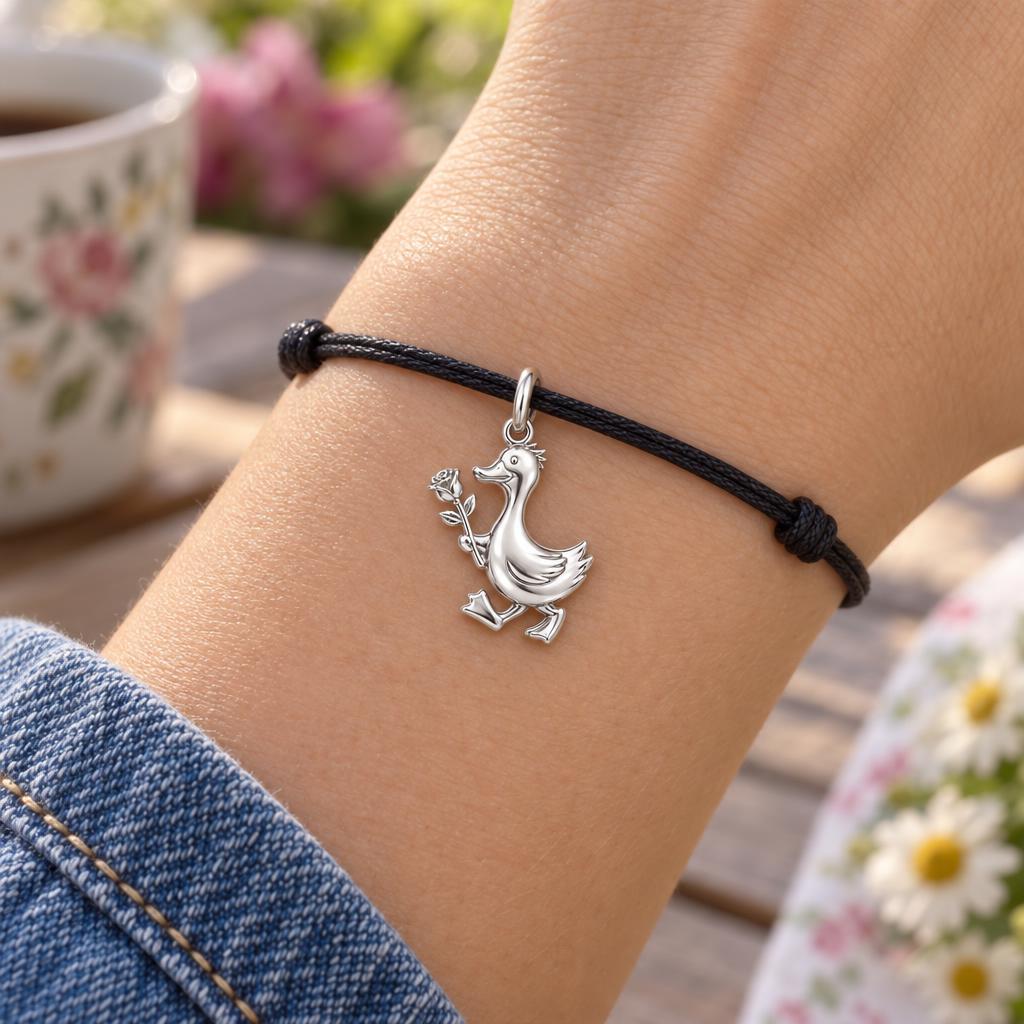 Gentle Duckling with Rose Charm Bracelet – Personalized Mom Gift – worn on the wrist on a black cord bracelet