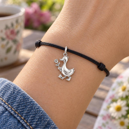 Gentle Duckling with Rose Charm Bracelet – Personalized Mom Gift – worn on the wrist on a black cord bracelet