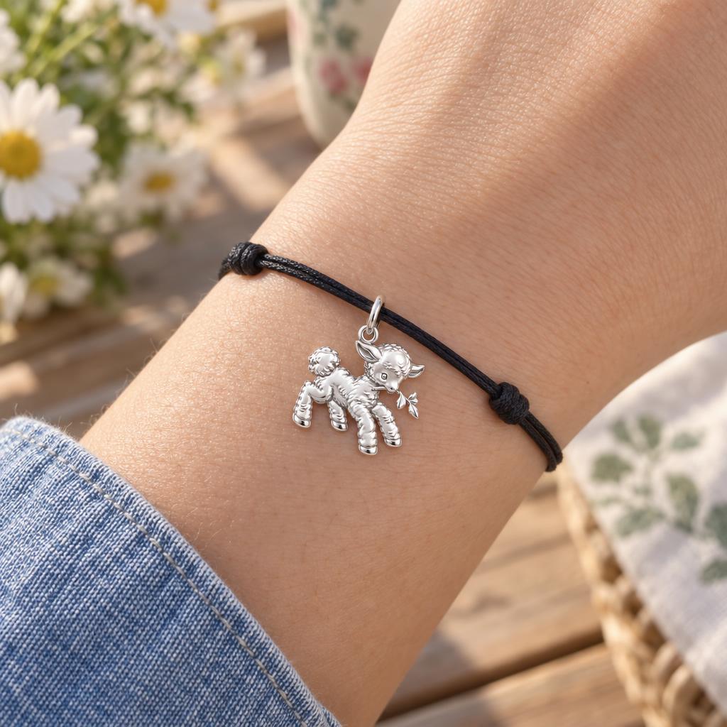 Gentle Spring Lamb Charm Bracelet – worn on the wrist on a black cord bracelet