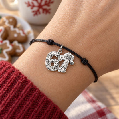Gingerbread Birthday Milestone Charm Bracelet – Personalized Mom Gift – worn on the wrist on a black cord bracelet