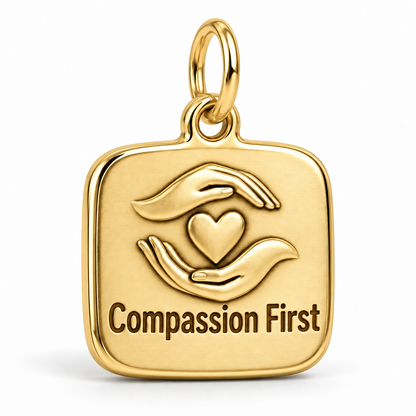Compassion First Engraved Nurse Charm | polished gold material view | 2425e00daffca29a52f015837d548b5cda65e0d26acd0b4d09957a133988a792