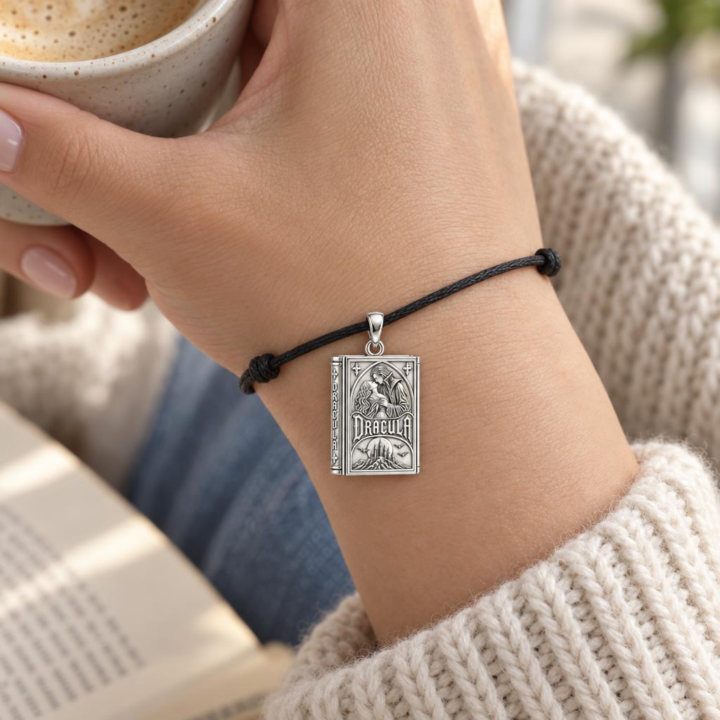 Gothic Dracula Tome Charm and Polyester Cord Bracelet Set – worn on the wrist on a black cord bracelet