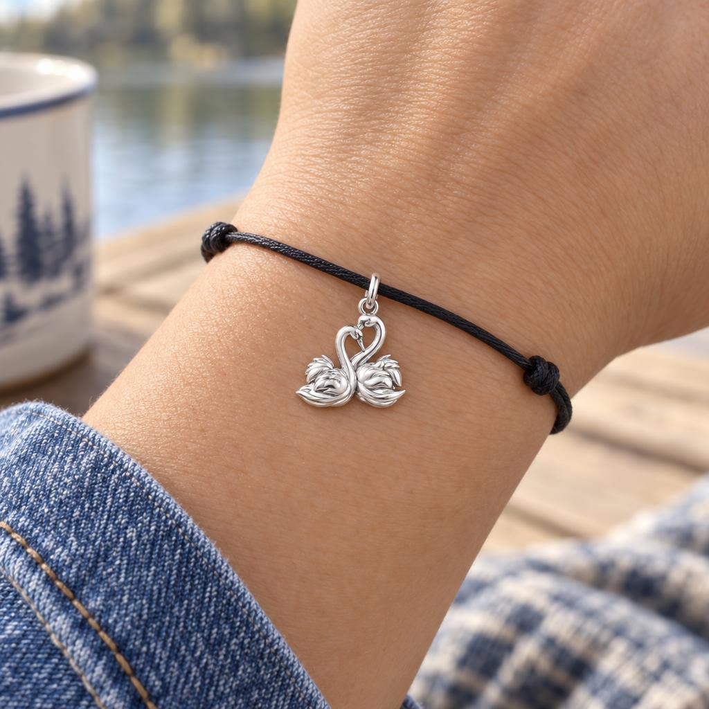 Graceful Swan Pair Charm Bracelet – Personalized Couple Gift – worn on the wrist on a black cord bracelet