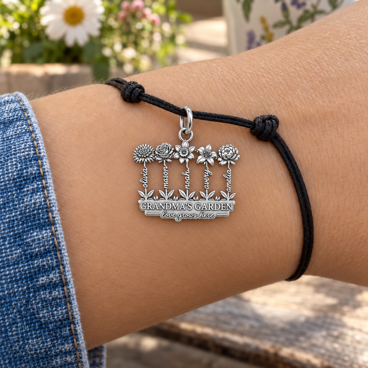 Grandma's Wildflower Garden Charm Bracelet – Personalized Gift – worn on the wrist on a black cord bracelet