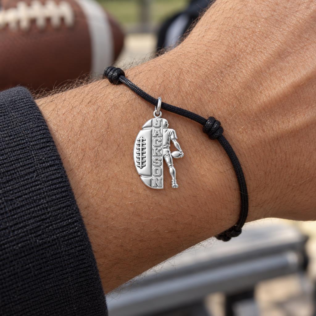 Gridiron Glory Charm Bracelet – Personalized Athlete Gift – worn on the wrist on a black cord bracelet