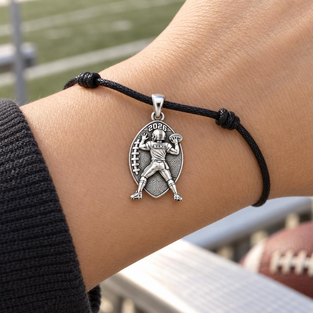 Gridiron Hero Charm Bracelet – Personalized Football Mom Gift – worn on the wrist on a black cord bracelet