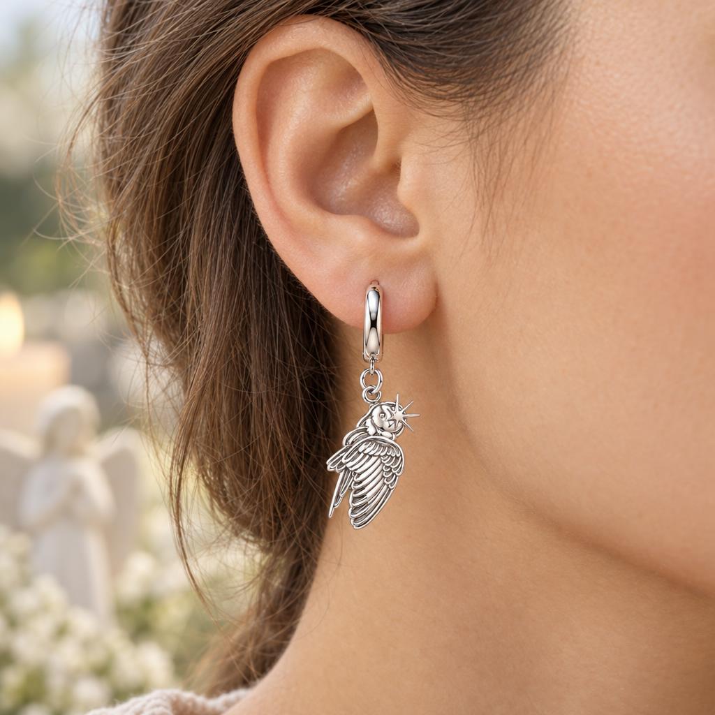 Guiding Star Angel Wing Huggie Charm Earrings – worn / in use