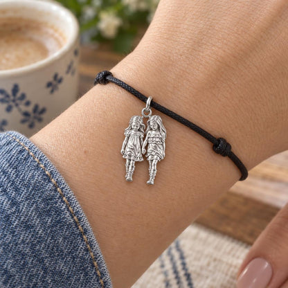 Hand in Hand Sisters Charm Bracelet – Personalized Mom Gift – worn on the wrist on a black cord bracelet
