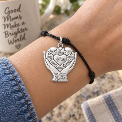 Heart Puzzle Piece Charm Bracelet – Personalized Mom Gift – worn on the wrist on a black cord bracelet