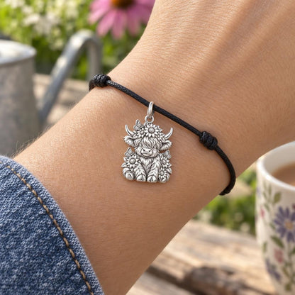 Highland Calf Garden Charm Bracelet – Personalized Mom Gift – worn on the wrist on a black cord bracelet