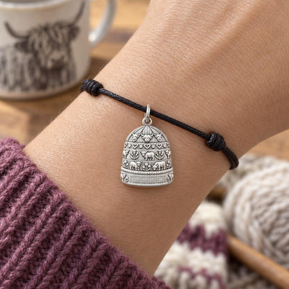 Highland Cow Winter Beanie Charm Bracelet – Personalized Mom Gift – worn on the wrist on a black cord bracelet