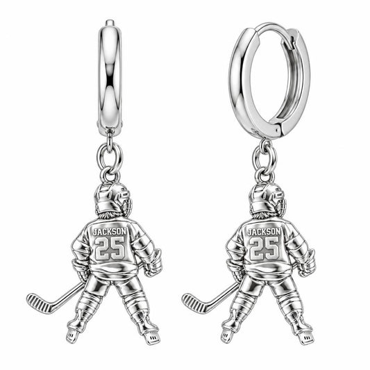 Hockey Star In Motion Huggie Charm Earrings – silver, front view