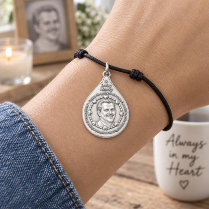 In Loving Memory Portrait Charm Bracelet – Personalized Memorial Gift – worn on the wrist on a black cord bracelet
