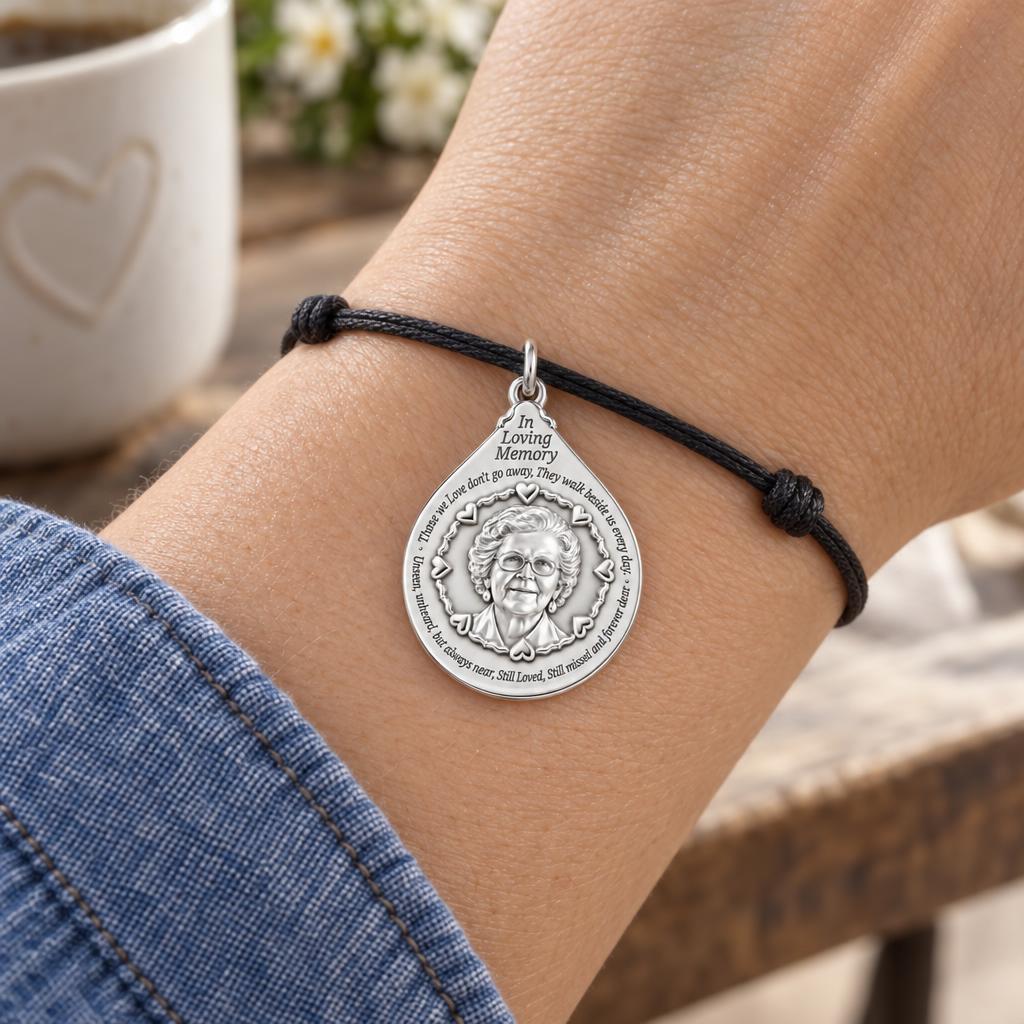 In Loving Memory Portrait Charm Bracelet – Personalized Memorial Gift – worn on the wrist on a black cord bracelet