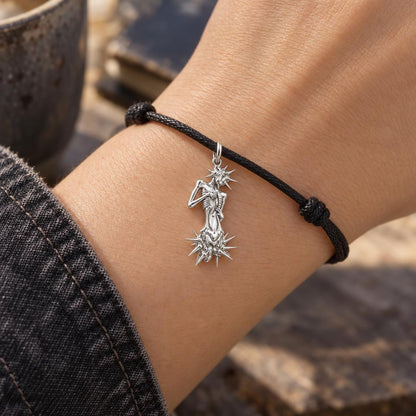 Inner Strength Spiked Figure Charm Bracelet – Personalized Gift – worn on the wrist on a black cord bracelet