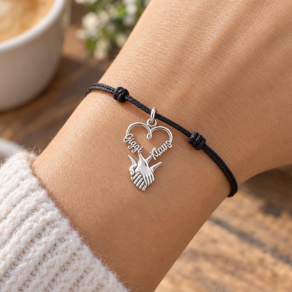Intertwined Hands Heart Charm Bracelet – Personalized Couple Gift – worn on the wrist on a black cord bracelet