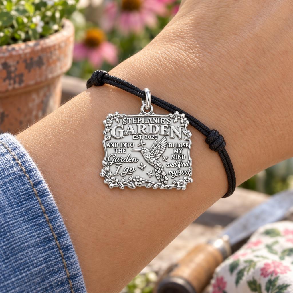 Into the Garden Charm Bracelet – Personalized Mom Gift – worn on the wrist on a black cord bracelet