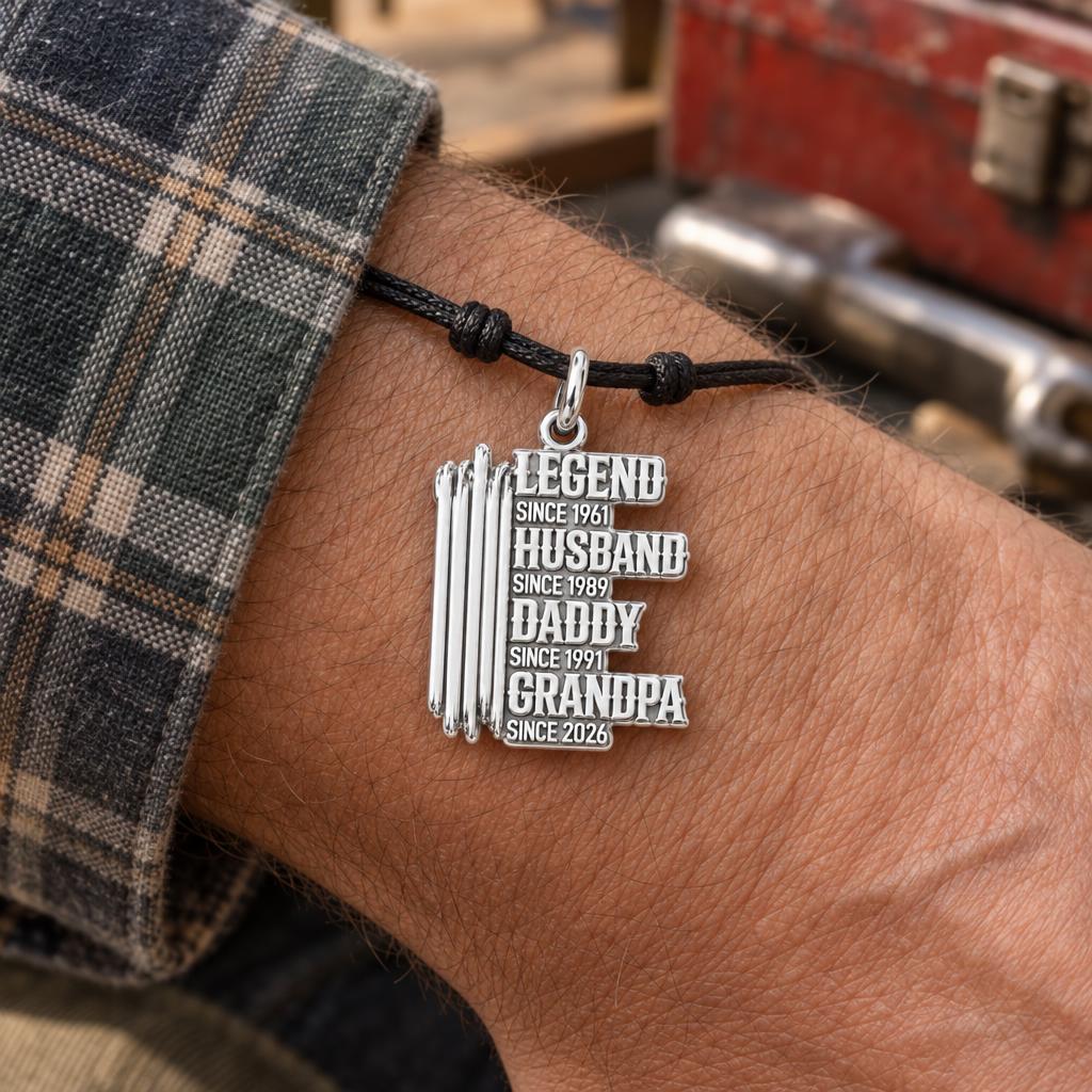 Legacy Timeline Charm Bracelet – Personalized Grandpa Gift – worn on the wrist on a black cord bracelet