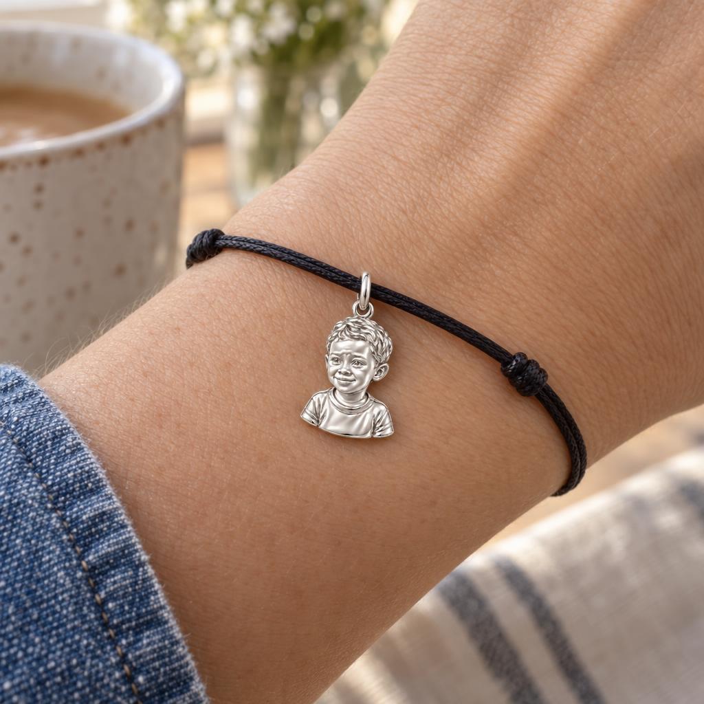 Little One Sculpted Portrait Charm Bracelet – Personalized Mom Gift – worn on the wrist on a black cord bracelet