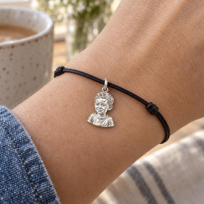 Little One Sculpted Portrait Charm Bracelet – Personalized Mom Gift – worn on the wrist on a black cord bracelet