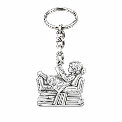 Little Reader on Book Stack Charm Keychain – silver, front view