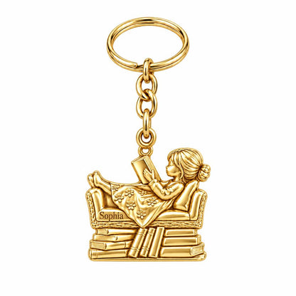 Little Reader on Book Stack Charm Keychain – 18K gold, front view