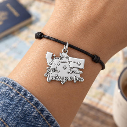 Long Distance Paper Plane Charm Bracelet – Personalized Couple Gift – worn on the wrist on a black cord bracelet