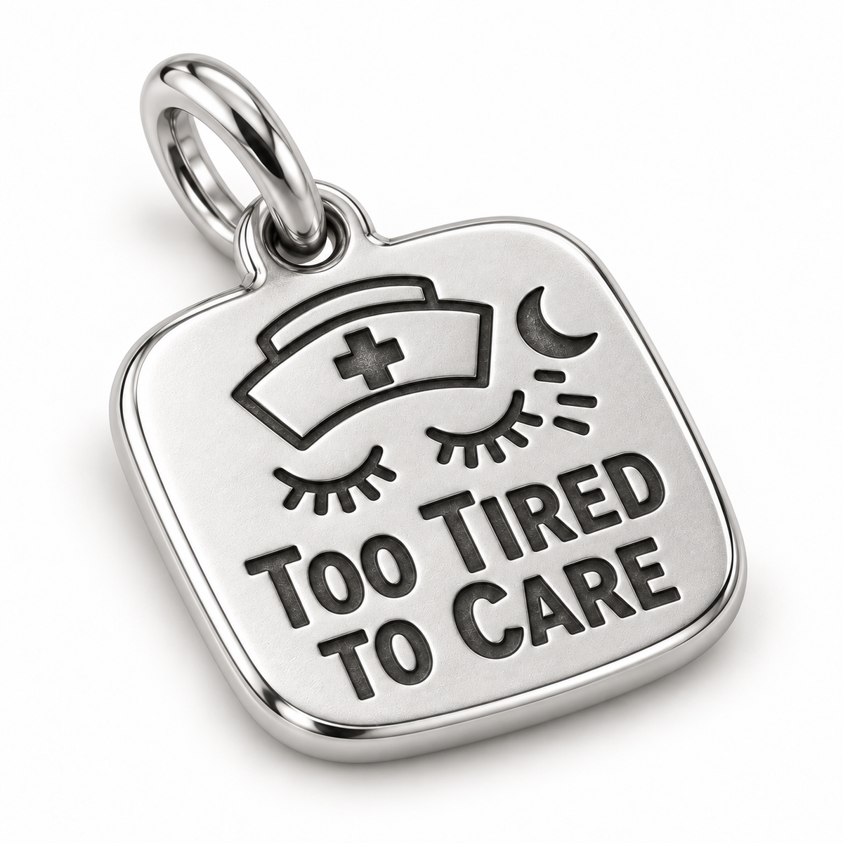 Too Tired to Care Engraved Nurse Charm | macro face-up oblique view | b8c9b50c5d6e431a4432002455543b87fb0dea86d8c1c18943290ff6567d59eb