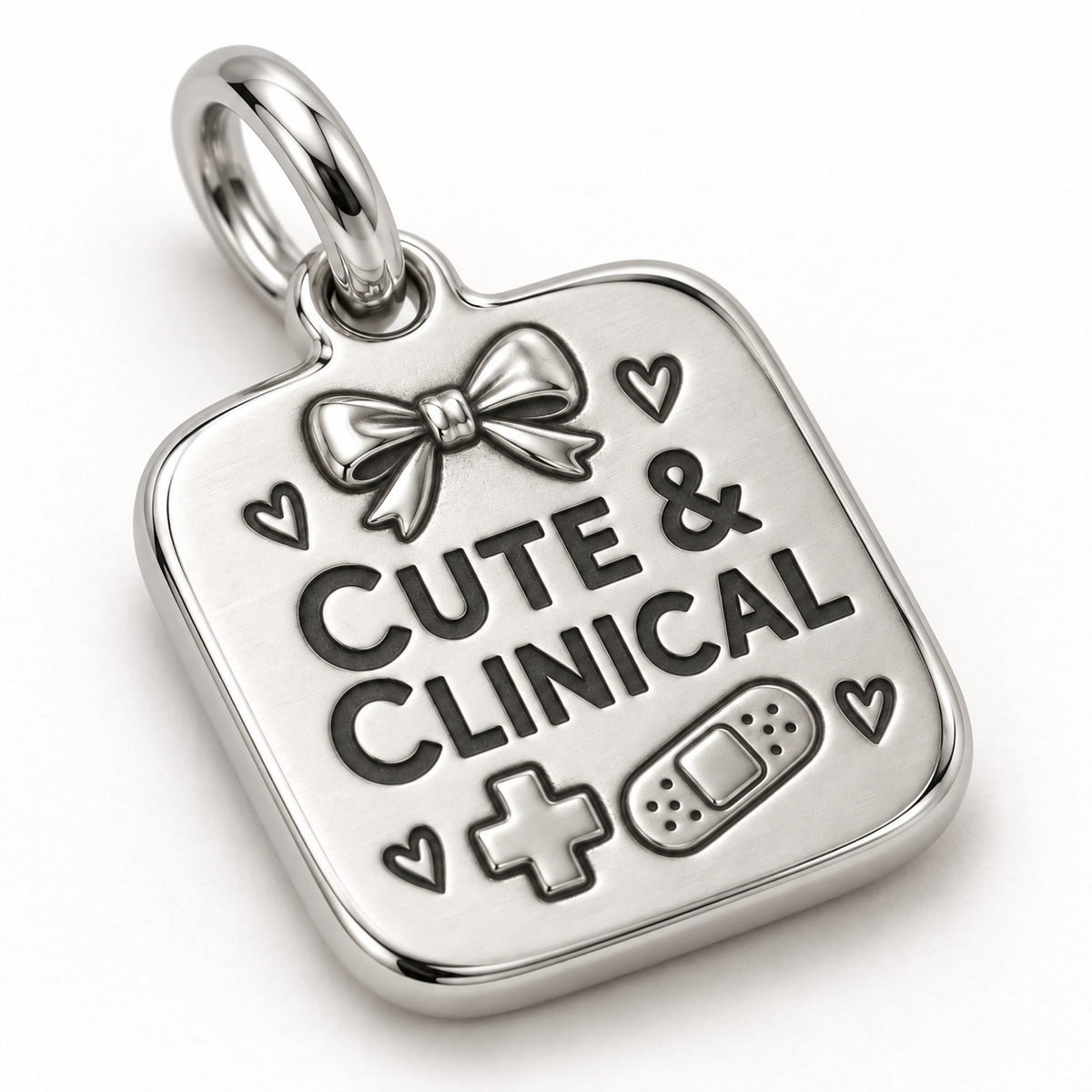 Cute & Clinical Engraved Nurse Charm | macro face-up oblique view | 9904948f27eca306437827a84f736efb885ae75bf8d3eda975c20776ddad72a4