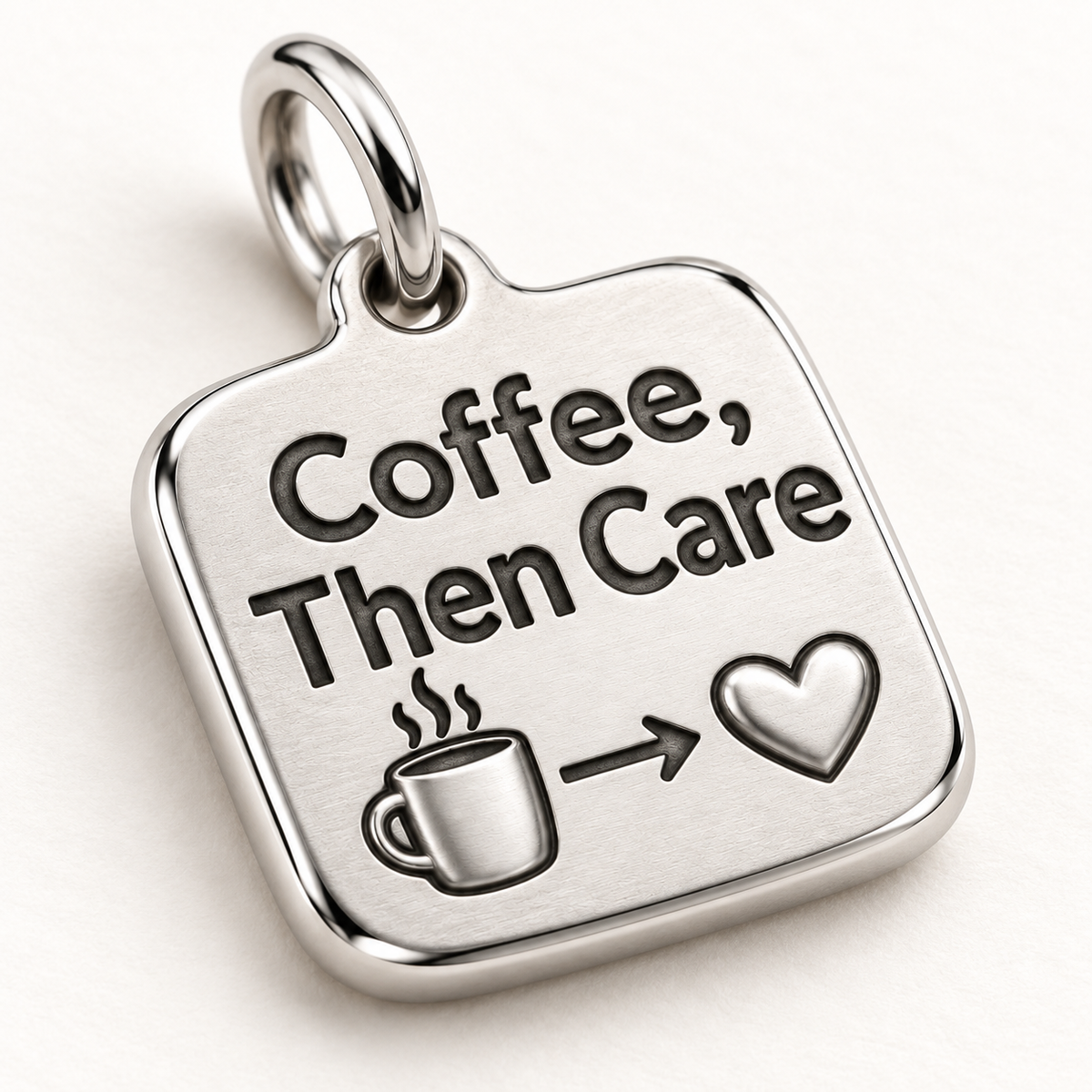 Coffee, Then Care Engraved Nurse Charm | macro face-up oblique view | 2c47fdcf40aa1d472bf8af30777f6144f97a028c0552d8b9969fb8629462ec7f