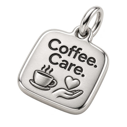 Coffee. Care. Engraved Nurse Charm | macro face-up oblique view | 7ec7e7d975d9312f2fabce41db4ff68e57ded2becebcb33a2e819a99c1b2ca0c