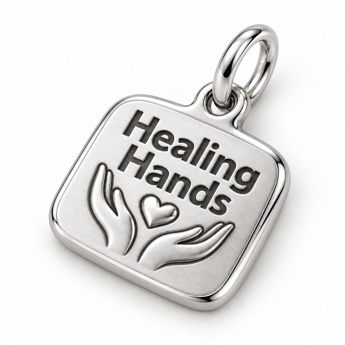 Healing Hands Engraved Nurse Charm | macro face-up oblique view | 48a6f0970b890ff9e0aa8fa6a28a6ad3a878505a0ca636eae7f091fcda32f17b