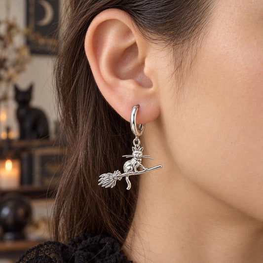 Midnight Flight Cat Huggie Charm Earrings – worn / in use