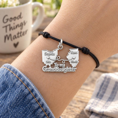 Miles Apart Connection Charm Bracelet – Personalized Granddaughter – worn on the wrist on a black cord bracelet