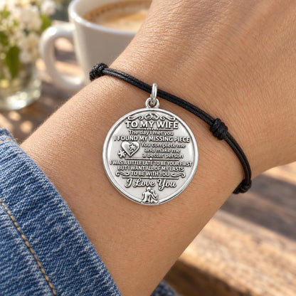 Missing Piece Charm Bracelet – Personalized Wife Gift – worn on the wrist on a black cord bracelet
